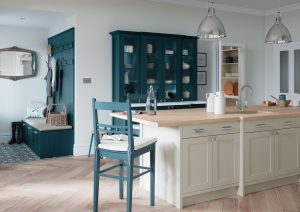 Alana Marine Blue and Stone shaker kitchen design by The Kitchen Depot. Matching Marine Blue chair alongside kitchen island