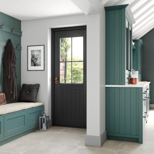 Alana Viridian Green shaker kitchen design by The Kitchen Depot. Back door and green shaker kitchen storage