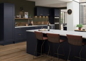 Firoenza shaker kitchen door in Indigo blue is showcased in this kitchen design, showing the doors in a kitchen design created by The Kitchen Depot. Theres is an island with white worktops and 3 stools.