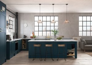 Our Georgina Shaker kitchen looks beautiful in Marine Blue. The design shows a sleek & modern twist on a traditional shaker door. The room has big windows and it has a modern warehouse look. The kitchen has an island, white worktops and stunning brown leather stools. Designed by The Kitchen Depot designers.