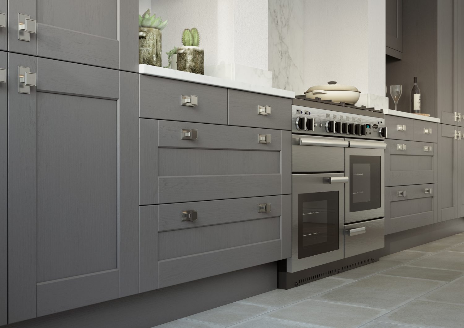 Kendal shaker kitchen drawers and cabinets in Dust Grey, made by The Kitchen Depot, alongside an oven.