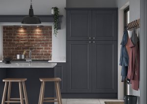 Kendal Indigo tall shaker kitchen larder and island with wooden stools, made by The Kitchen Depot