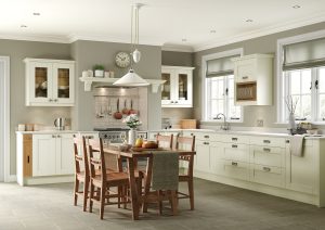 The Kendal shaker kitchen range, with prominent V-Grooves in Ivory, made by The Kitchen Depot