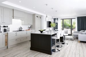 Madison Cashmere shaker kitchen with Graphite Grey island and modern seating, made by The Kitchen Depot