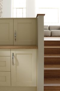 Madison shaker kitchen cbainet door in Ivory alongside staircase, made by The Kitchen Depot