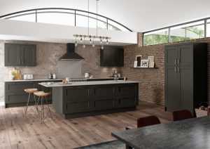 Angle of Kendal Graphite Grey shaker kitchen with tall cabinet, made by The Kitchen Depot