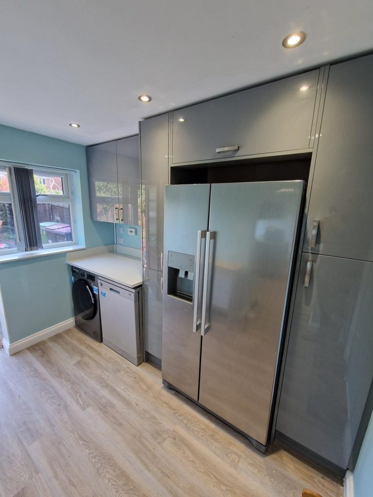 The Lawson family's fridge in their Zara Gloss Dust Grey Kitchen