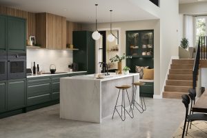 Hartford handleless Heritage Green shaker door by the The Kitchen Depot showcased in a kitchen with an island