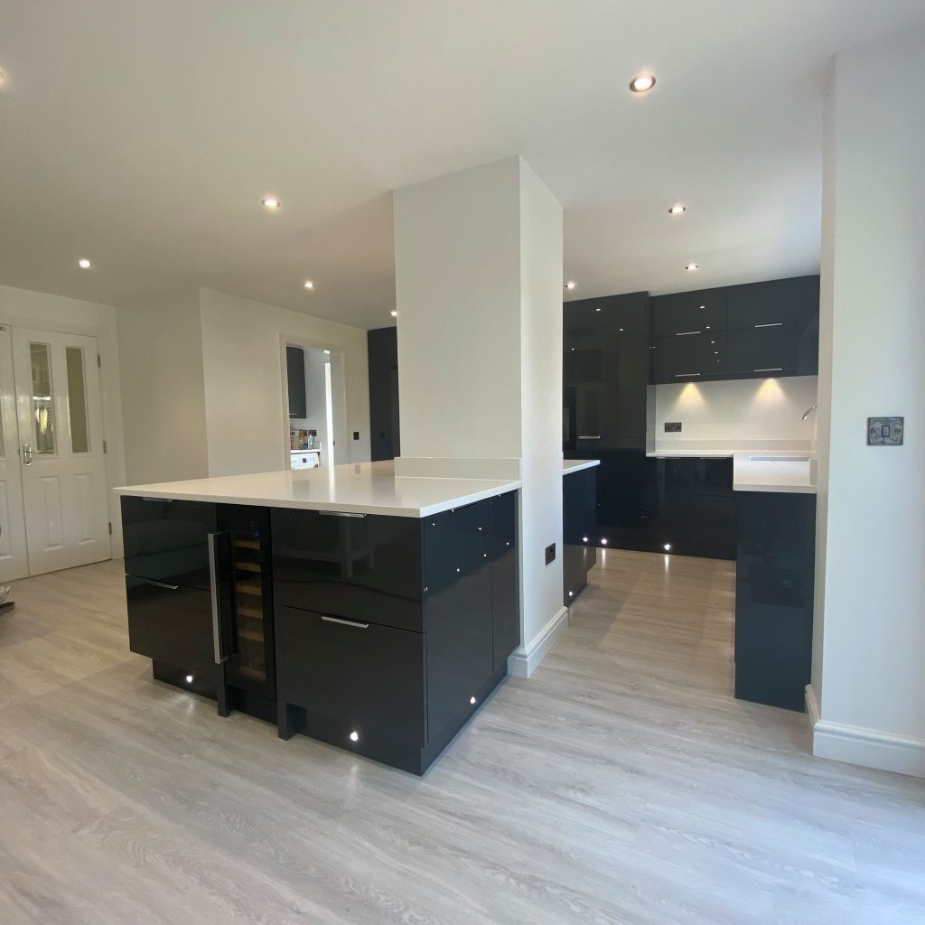 Gloss Graphite kitchen with white worktop island made by The Kitchen Depot 3