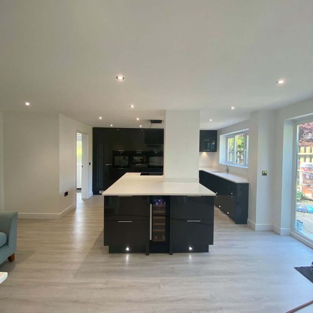 Gloss Graphite kitchen with white worktop island made by The Kitchen Depot 4