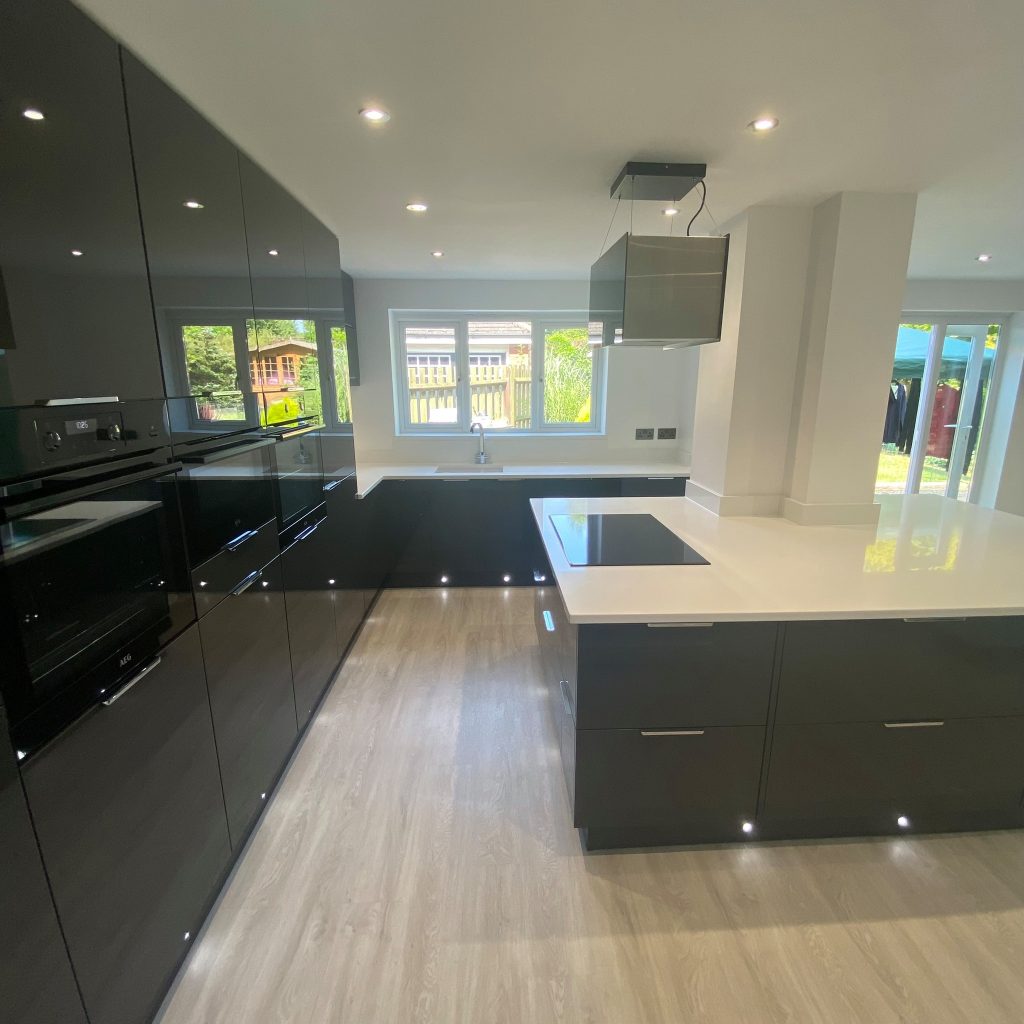 Gloss Graphite kitchen with white worktop island made by The Kitchen Depot 2