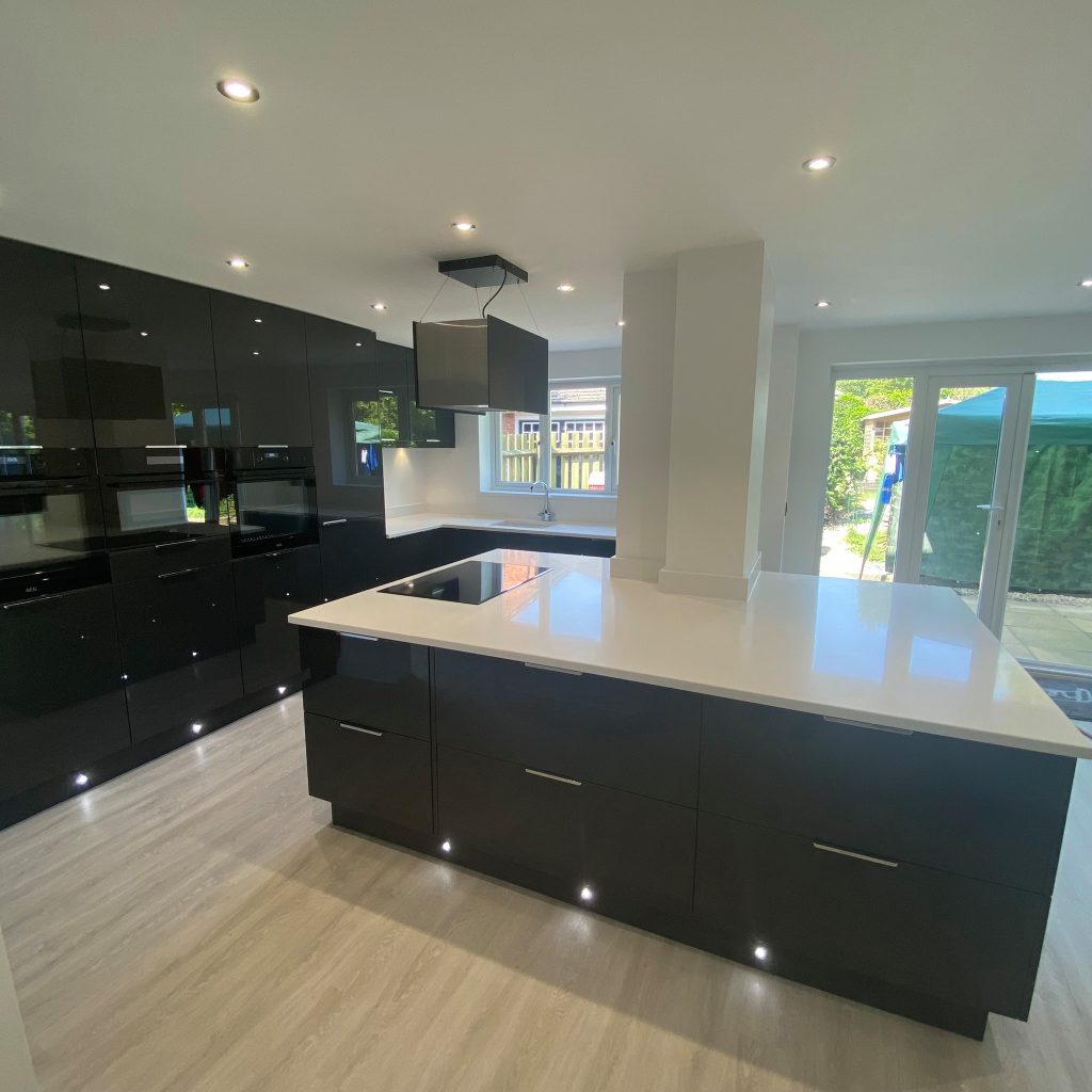 Gloss Graphite kitchen with white worktop island made by The Kitchen Depot