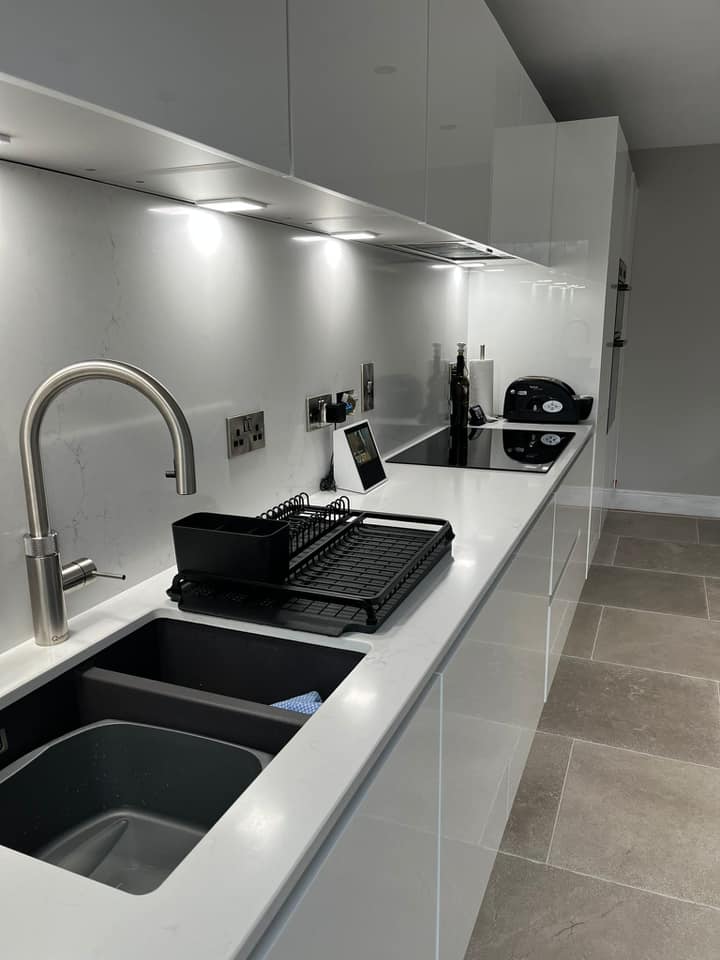 White Gloss kitchen units with sink and tap