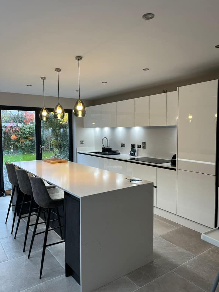White Gloss and Silver Metal Slate modern kitchen with island with chairs and pendant lighting