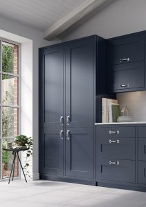 A side on viewpoint of this Olympia Indigo shaker kitchen design is shown here. Included is a close up of shaker indigo tall larders.