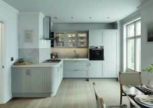 L shaper shaker kitchen with Skye shaker doors in light grey. Wooden floors and white walls create a light and airy kitchen space