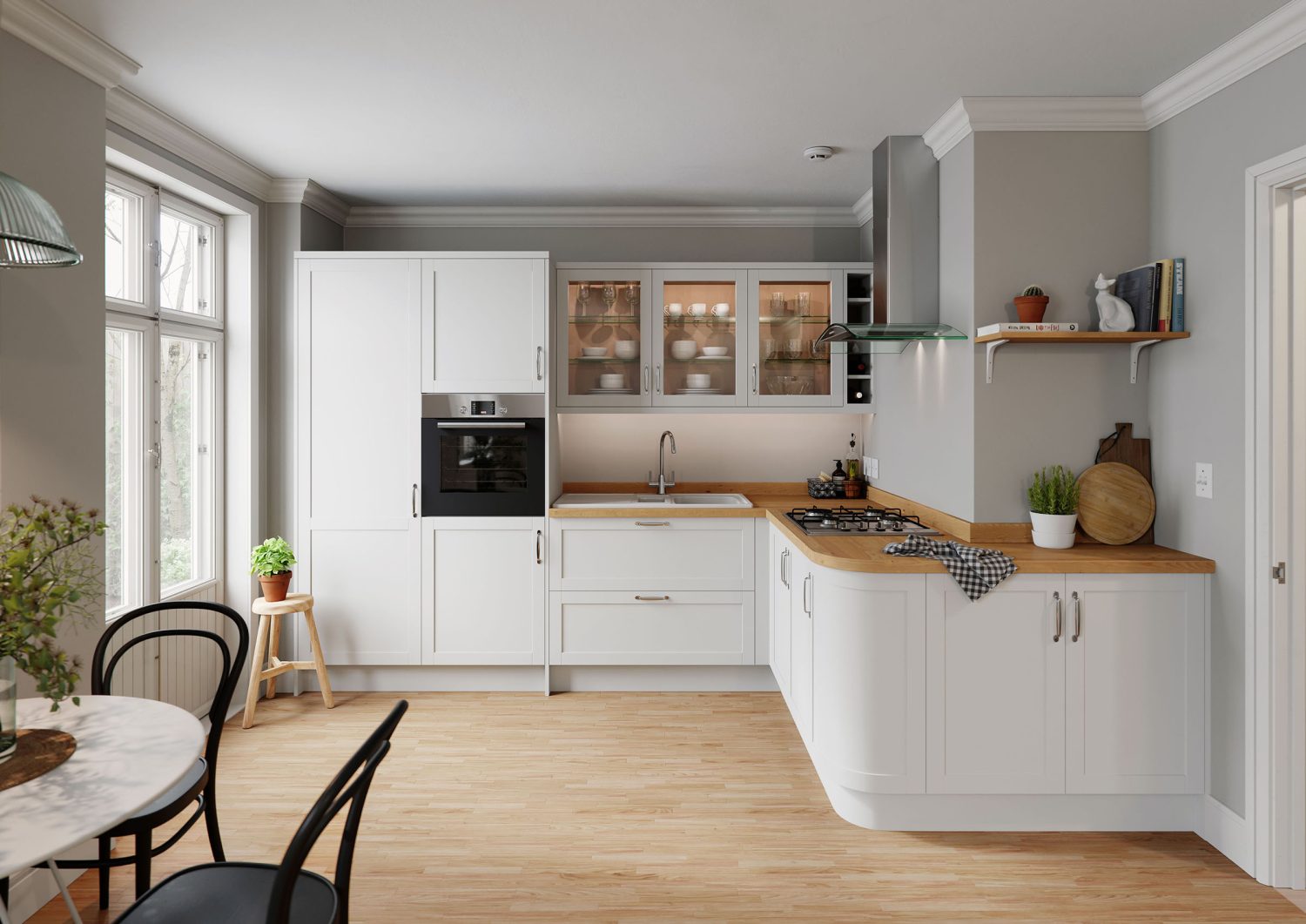 Skye shaker vinyl door is showcased in this traditional style kitchen with a modern twist. Wooden worktops and white shaker doors bring this L-shaped kitchen to life, with a light and airy feel. Glass cabinets with mugs, cups and plated are placed abut the sink on the kitchens back run. There is a gas hob and stainless steel oven hood and extractor fan.