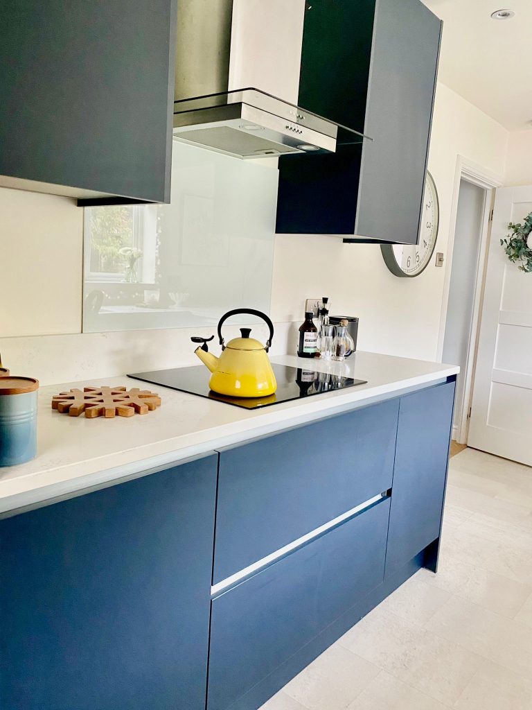 Handleless Indigo Blue doors and Carrara Quartz work surfaces.