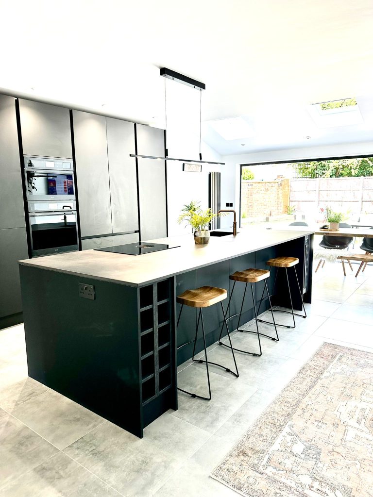 The Setterfield's Matte Black Linea Kitchen with open plan layout