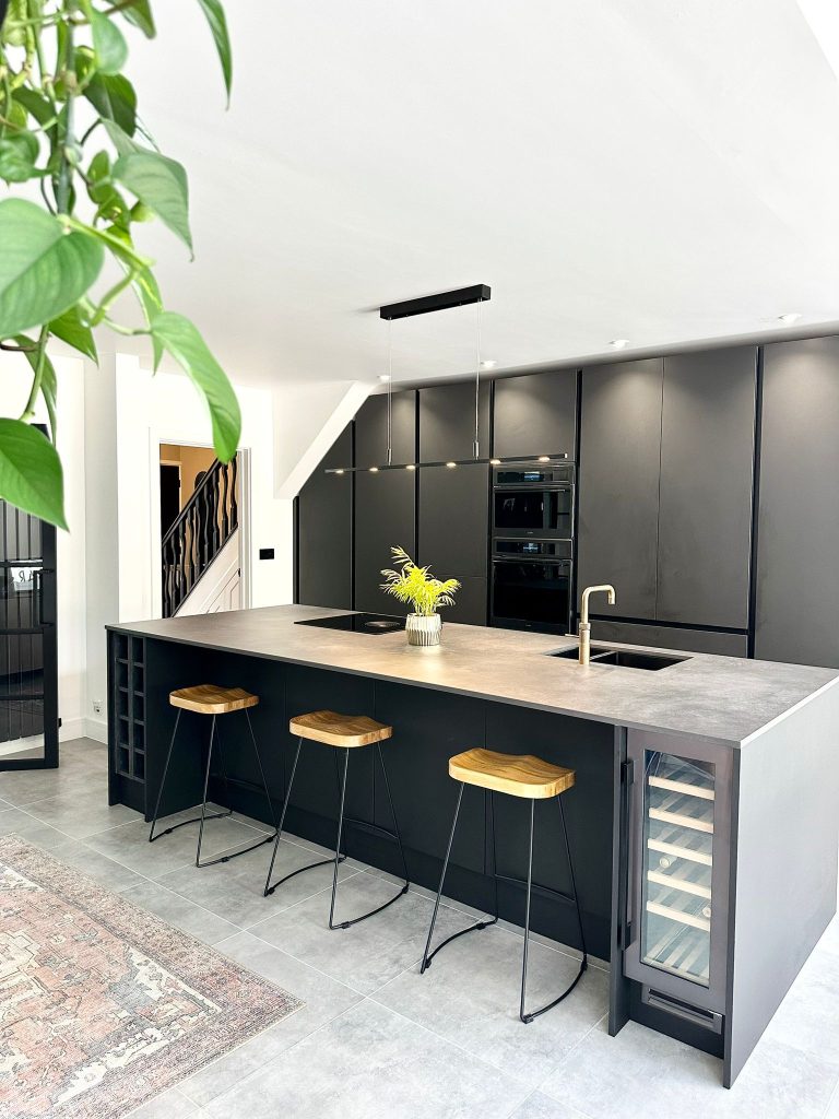The Setterfields Matte Black Linea Kitchen with Laminam worktop on island and stools