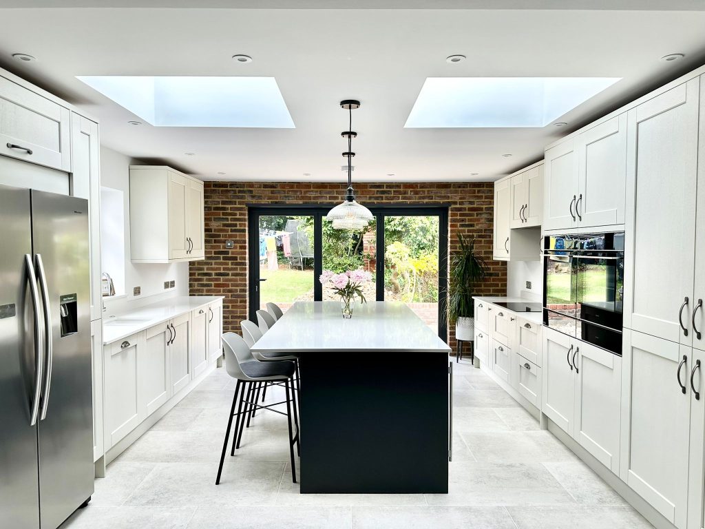 McLaren's Graphite & Mussel Shaker kitchen featuring island in open plan layout