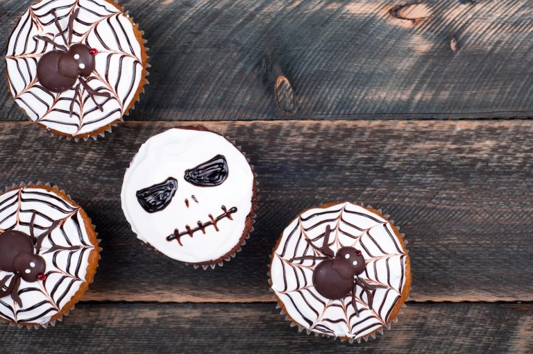Halloween inspired cupcakes featuring a spider and skull