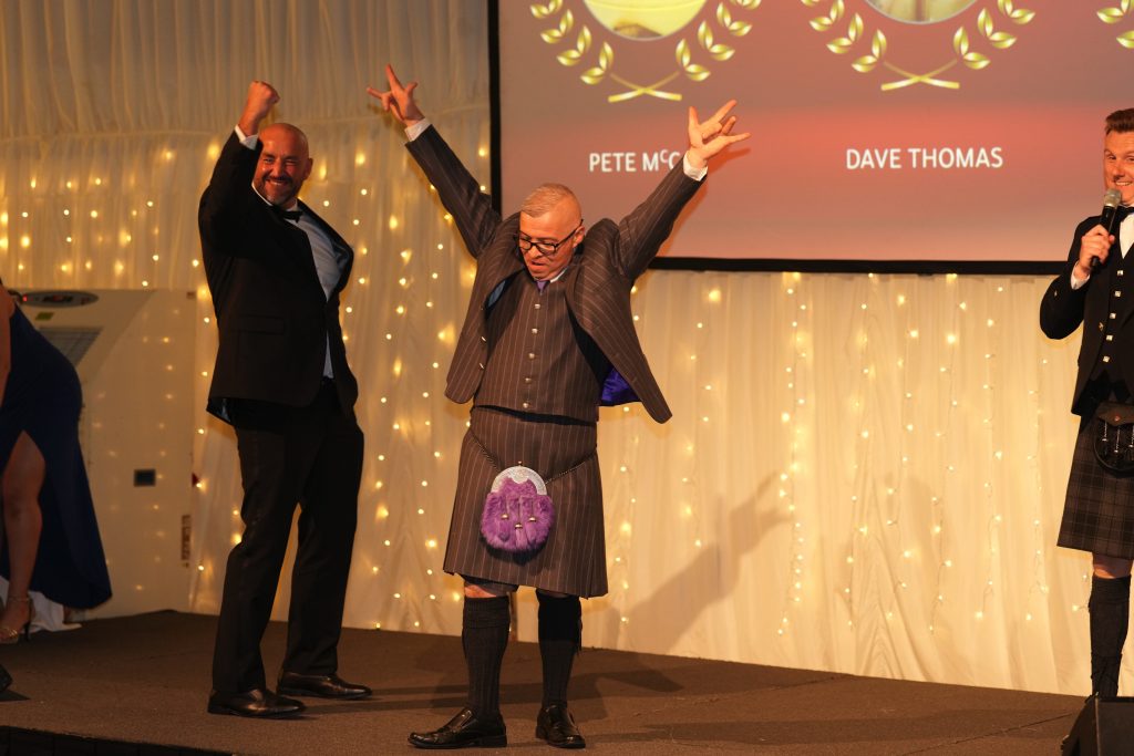 Peter McCay and Douglas Graham celebrating winning an award at The Kitchen Depots 20th Anniversary Celebration