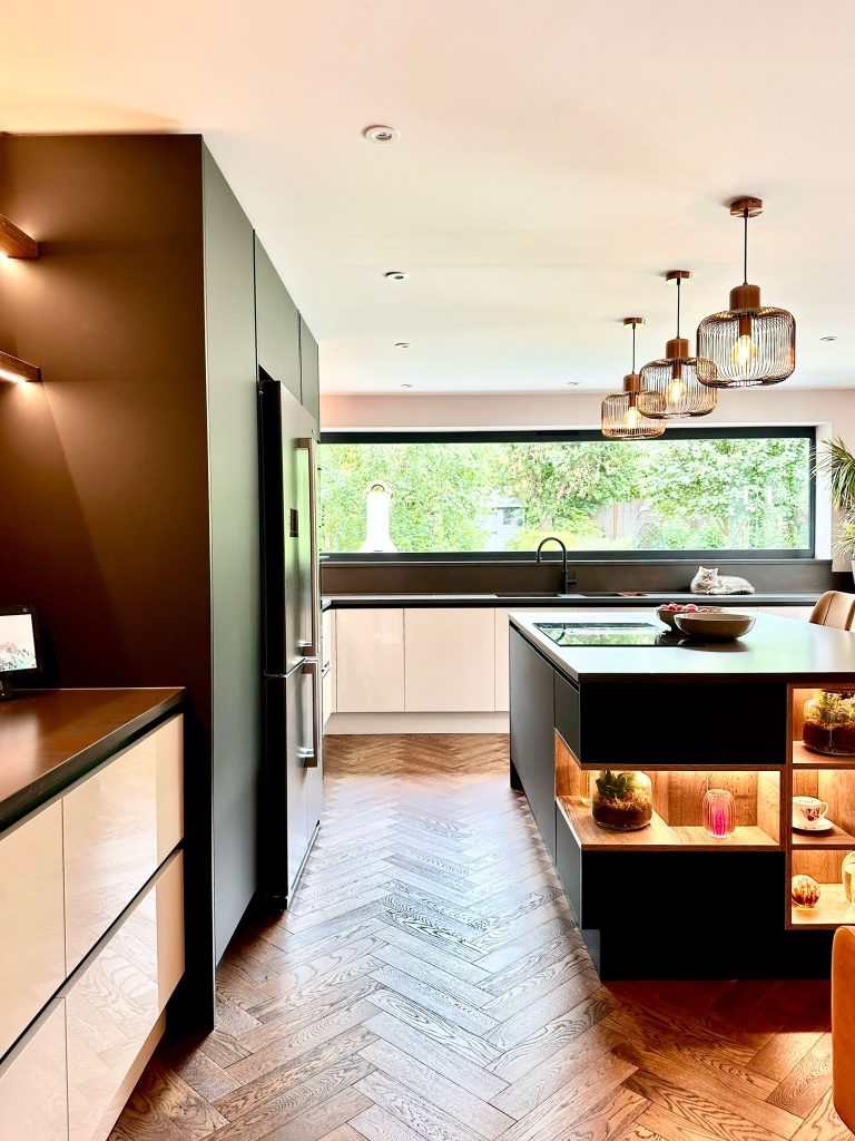 LINEA Matte Black & Cashmere Gloss Kitchen with under cabinet lighting and long window