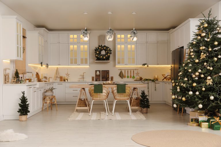 A kitchen decorated with Christmas lights and tree