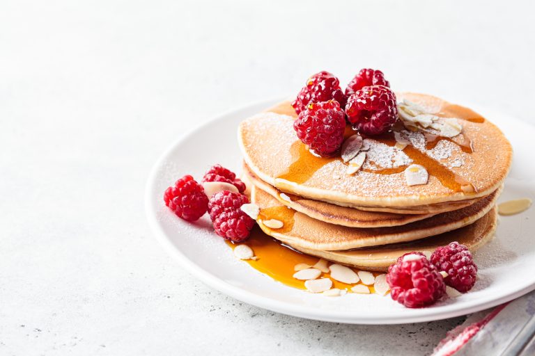 Stack of Mother's day pancakes with raspberries