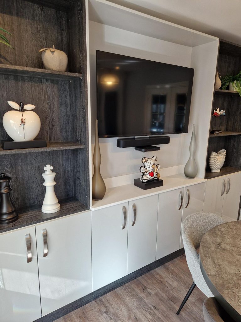 The Evans family new media station with Black Glazed Halifax Oak shelving and Zara Gloss Light Grey doors by The Kitchen Depot