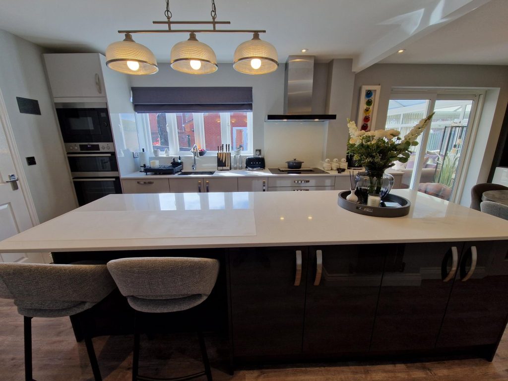 The Evans family new Zara Gloss Light Grey and Graphite modern kitchen design by The Kitchen Depot kitchen island with chairs