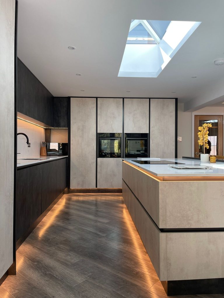 The Midwinter's open plan kitchen featuring Linea White Chromix and Silver Metal Slate doors